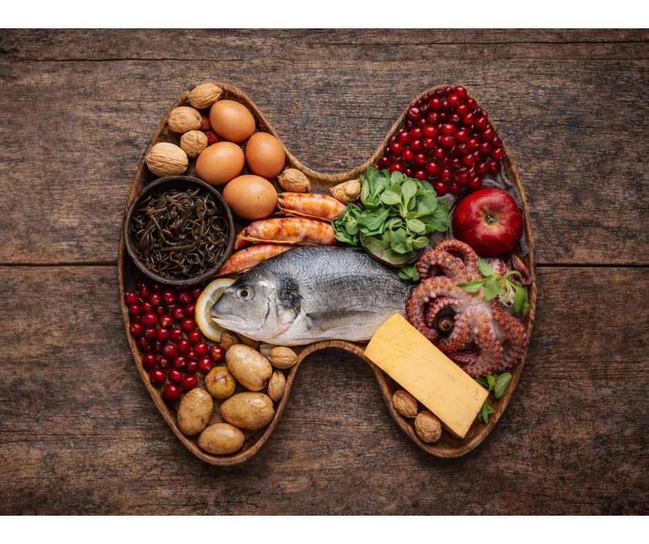 iodine-rich foods and iodine supplement arranged in a thyroid shape on rustic wood background illustrating context-dependent thyroid health – dr martina sturm